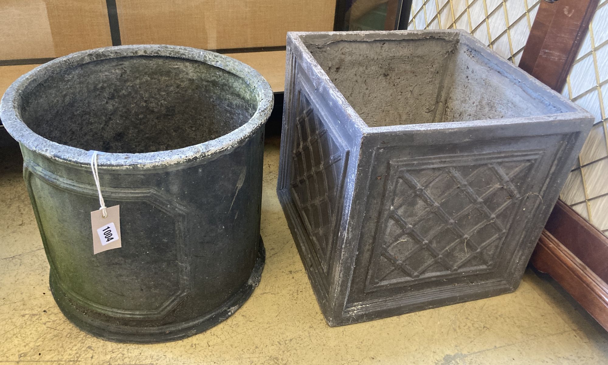 Two faux lead garden planters, larger width 37cm, height 38cm